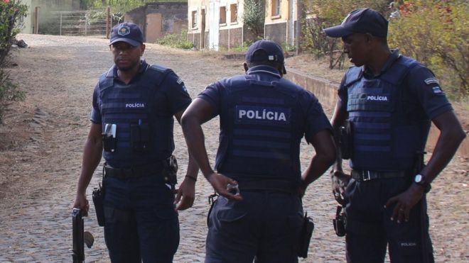 Police secure the area where 11 men were shot dead in Monte Tchota, Cape Verde - 26 April 2016