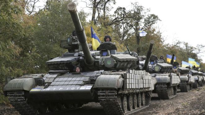 Ukrainian tanks are pulled back from the frontline in the east