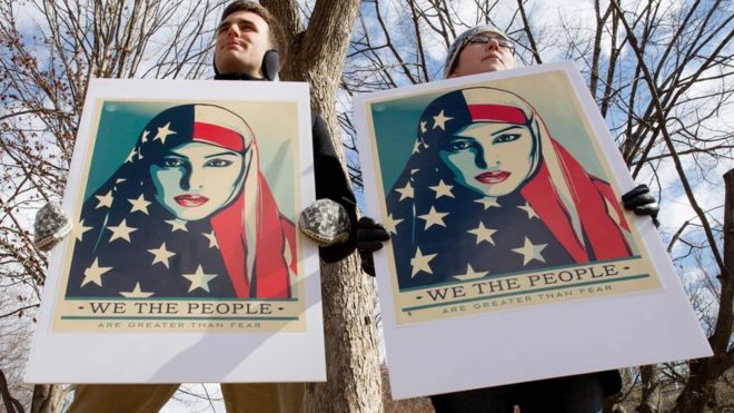 Demonstrators gather near The White House to protest President Donald Trump's travel ban on March 11, 2017 in Washington