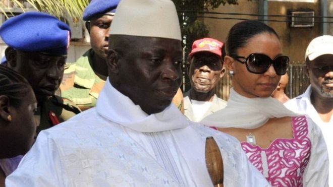 Gambian incumbent Yahya Jammeh (L) accompanied by his wife Zeineb Souma Jammeh (R) gets ready to vote on November 24 2011 at a polling station in the capital Banjul