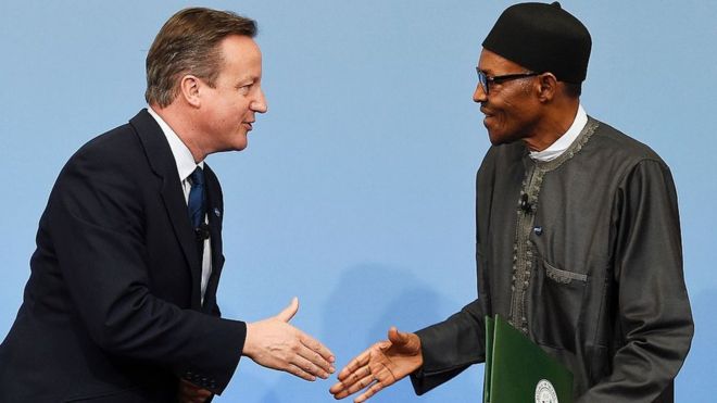 David Cameron (L) greets Nigerian President Muhammadu Buhari during the Anti-Corruption Summit London 2016, at Lancaster House in central London on May 12, 2016