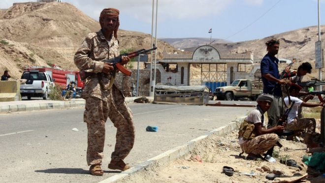 Yemeni soldiers stand guard outside security camp following suicide attack in port of Mukalla. 15 May 2016