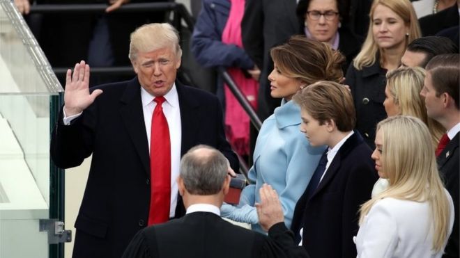 President Donald Trump is sworn in by Chief Justice John Roberts in Washington.