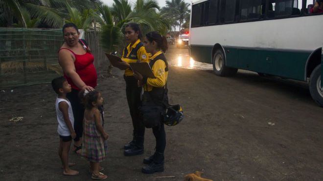 Residents of Boca de Pascuales, Colima State, Mexico, prepare to be evacuated on October 22, 2015, before the arrival of hurricane Patricia
