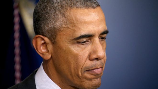 President Barack Obama frowns during a press conference on the college shooting in Oregon.