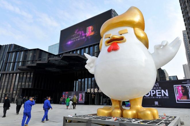 A giant rooster sculpture resembling Donald Trump outside a shopping mall in Taiyuan, Shanxi province. 24 December 2016.