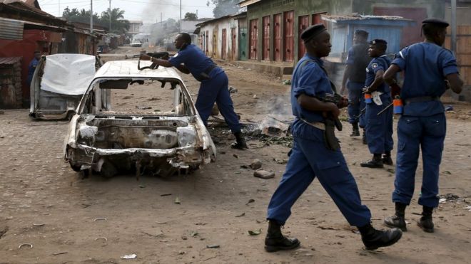 A policeman holds his rifle at a barricade during a protest against Burundi President Pierre Nkurunziza and his bid for a third term in Bujumbura, Burundi, in this May 26, 2015 file photo