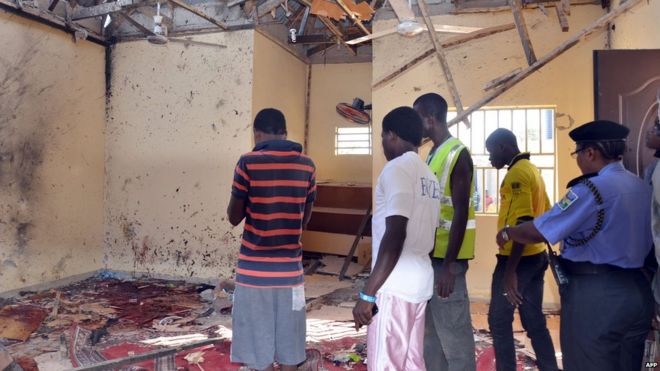 A picture taken on October 23, 2015 in Maiduguri, northeast Nigeria, shows people standing in a mosque following a suicide bombing