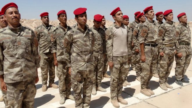 Iraqi Sunni tribesmen attend a weapons-presentation ceremony at Camp Habbaniyah, near Ramadi, on 3 September 2015