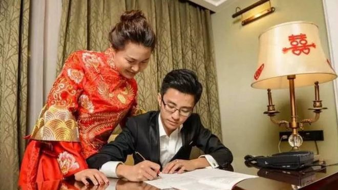 Photo of a Chinese couple on their wedding night