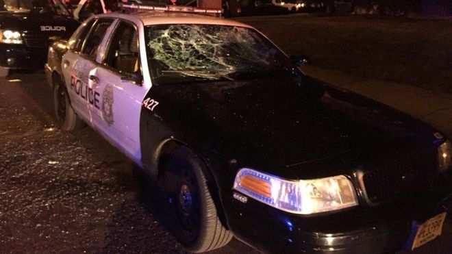 A police car with broken windows is seen in a photograph released by the Milwaukee Police Department after disturbances in the city (13 August 2016)