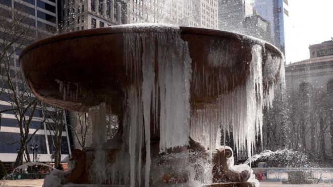 Josephine Shaw Lowell Memorial Fountain in Bryant Park, New York City, is covered in ice. 13 March 2017