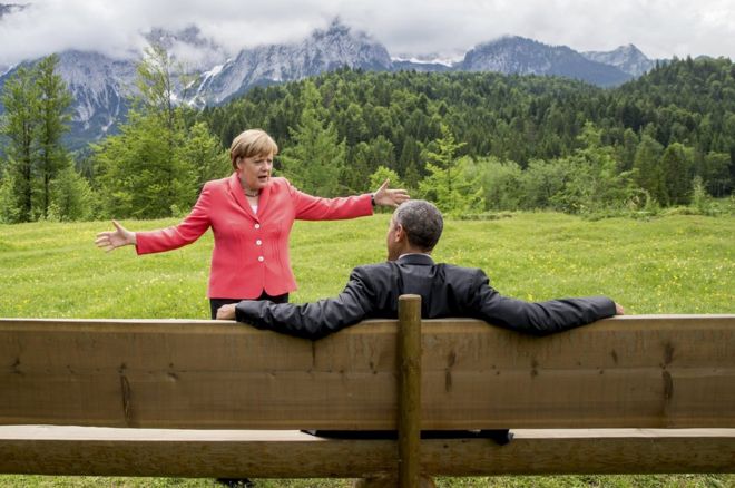 German Chancellor Angela Merkel speaks with US President Barack Obama outside the Elmau castle in Kruen near Garmisch-Partenkirchen, Germany