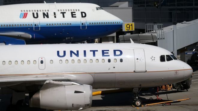 Two United Airlines planes parked at the terminal at San Francisco International Airport on August 24, 2012