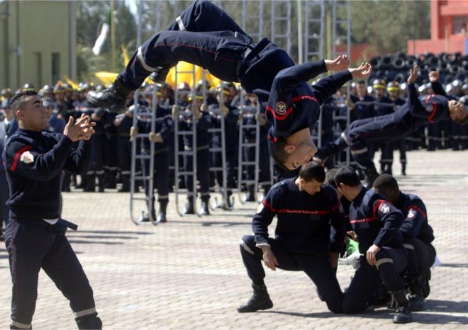Algerian fire-fighters on Tuesday show their skills during a ceremony marking the launch of a safety project .