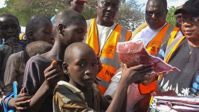 Aid distribution at camp for displaced people in Nigeria
