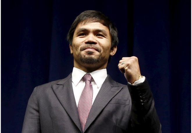 Eight-division world champion Manny "Pac-Man" Pacquiao attends a news conference ahead of his upcoming bout with five-division world boxing champion Floyd "Money" Mayweather (not seen), in Los Angeles, California in this 11 March 2015 file photo