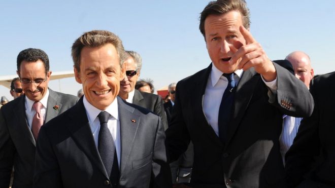 Former French president Nicolas Sarkozy and David Cameron arrive at Benghazi airport in 2011
