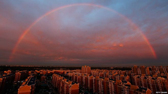 A rainbow appears over the city on August 3, 2015 in Beijing, China.