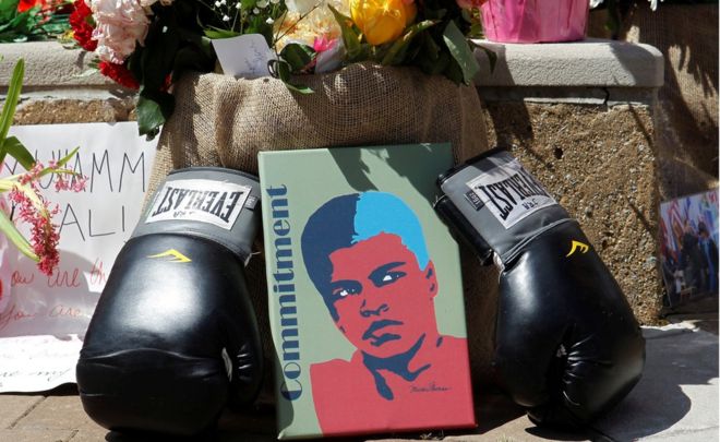 Fans of Muhammad Ali, the former world heavyweight boxing champion, leave pictures and personal mementos as they pay their respects at the Ali Center in Louisville, Kentucky, U.S. June 7, 2016