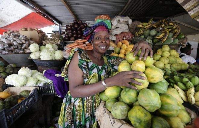 A fruit vendor in her shop in Abidjan Ivory Coast on 7 March.