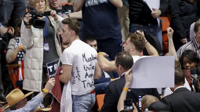Protesters clashes with supporters at the University of Illinois Pavilion in Chicago