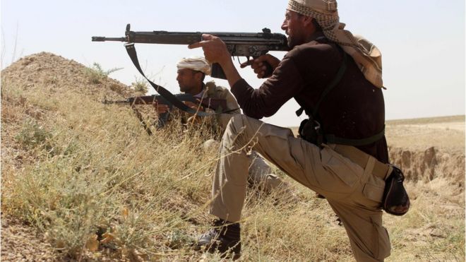 Iraqi soldiers guard a position on the front line against Islamic State (IS) group jihadists near Fallujah, in Iraq"s Anbar province, on May 3, 2016