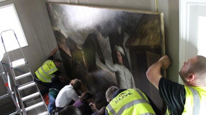 The Great Horse painting being re-hung at Croome Court, Worcestershire