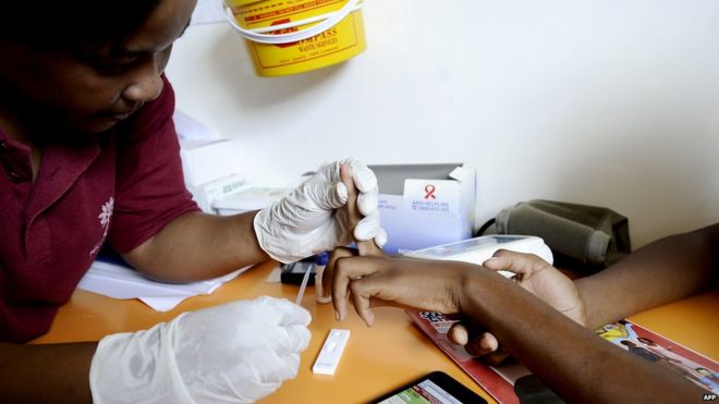Nurse takes a blood sample on March 8, 2011 in a mobile clinic set up to test students for HIV at Madwaleni high school near Mtubatuba in Kwazulu Natal, South Africa.