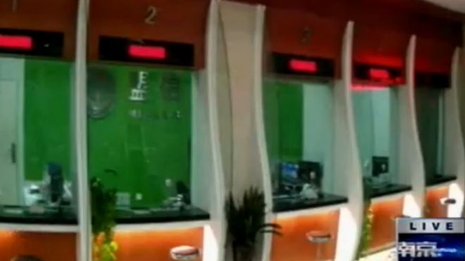 Chinese TV footage of inside the bank showing the counters
