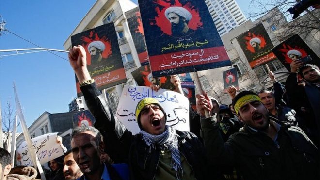 Iranian protesters hold placards of Nimr al-Nimr at a demonstration near Saudi embassy in Tehran (03/01/16)