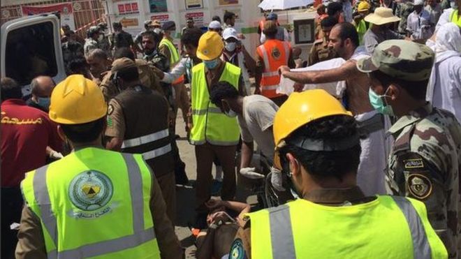 Photo posted on Twitter by Saudi Civil Defence Authority on 24 September 2015 showing medics treating man wounded in stampede at Hajj pilgrimage outside Mecca