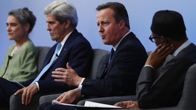 David Cameron on a platform with the US secretary of state, John Kerry, and the President of Nigeria, Muhammadu Buhari