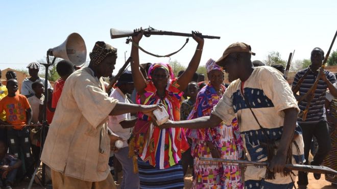 Traditional hunters in dancing gear