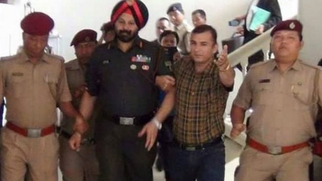 Colonel Jasjit Singh being arrested