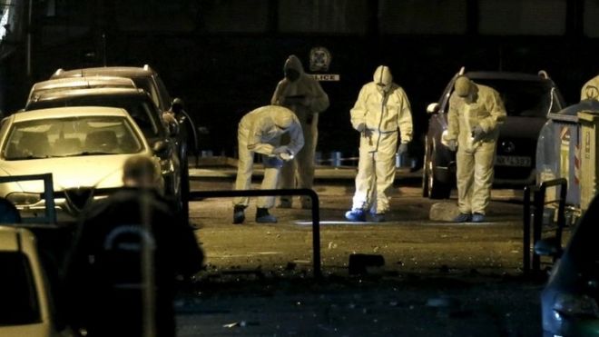 Forensic experts gather evidence at the blast site in central Athens. Photo: 24 November 2015