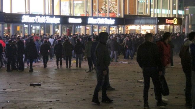 People gathering in front of the main railway station in Cologne, Germany, 31 December 2015