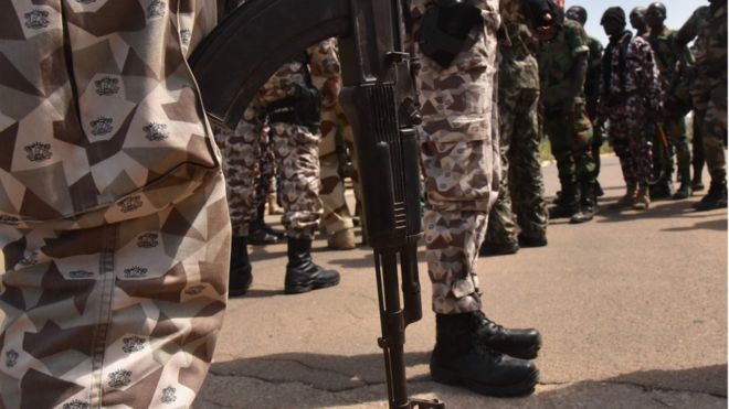 Ivory Coast soldiers standing guard at the airport in Bouake