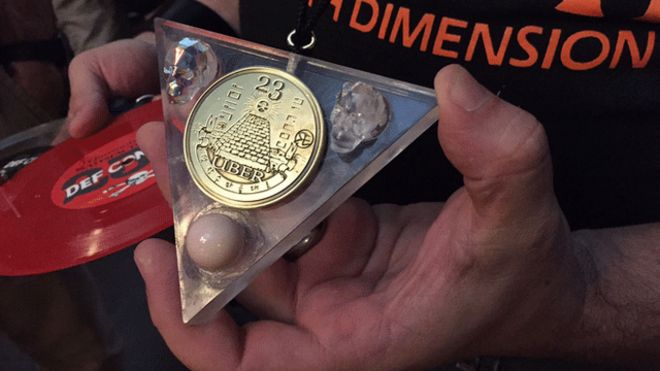 A Def Con delegate with badge and record