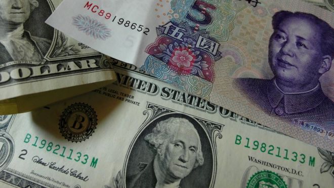 Dollars and Yuan banknotes