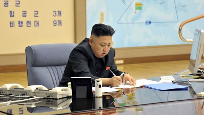 North Korean leader Kim Jong-un presides over an operation meeting on the Korean People"s Army Strategic Rocket Force"s performance of duty for firepower strike at the Supreme Command in Pyongyang, in this March 29, 2013