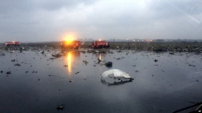 Russian emergency fire trucks are seen among the wreckage of a crashed plane at the Rostov-on-Don airport,