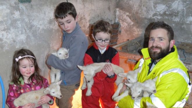 Shannon family with lambs