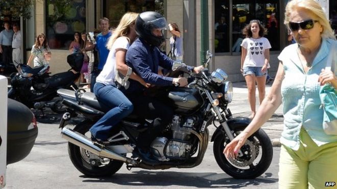 Yanis Varoufakis leaves the Ministry of Finance after resigning with his wife Danai on his motorbike