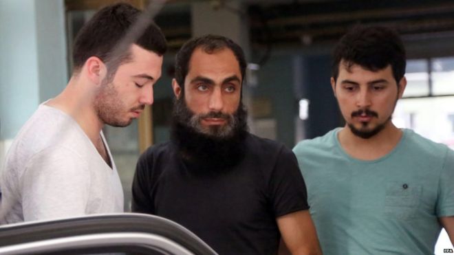Anti-terror police detain an alleged member of Islamic State (centre) in Istanbul, Turkey (10 July 2015)