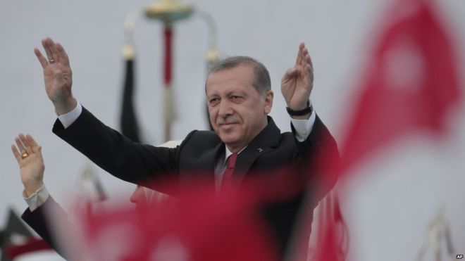 Turkey's President Recep Tayyip Erdogan waves to crowds during a rally to commemorate the anniversary of the city's conquest by the Ottoman Turks, Istanbul, Turkey, Saturday, 30 May 2015