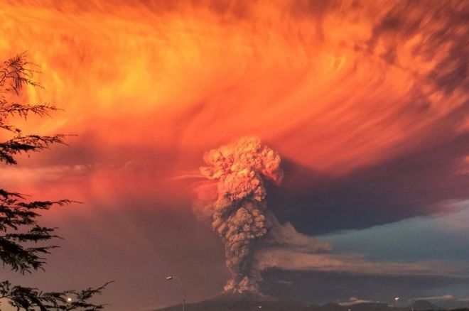 Smoke and ash rise from the Calbuco volcano as seen from the city of Puerto Montt, Chile, 22 April 2015