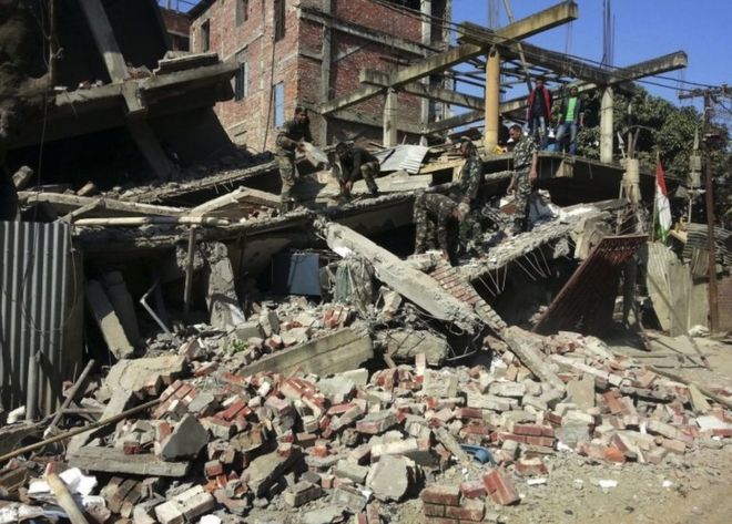 Indian soldiers remove debris from a house that collapsed in an earthquake in Imphal, capital of the north-eastern Indian state of Manipur, Monday, Jan. 4, 2016.