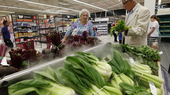 Customers shopping for vegetables