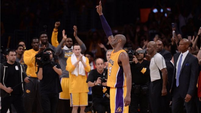 Los Angeles Lakers forward Kobe Bryant (24) waves to the Staples Center crowd as he leaves the game against the Utah Jazz in the closing seconds